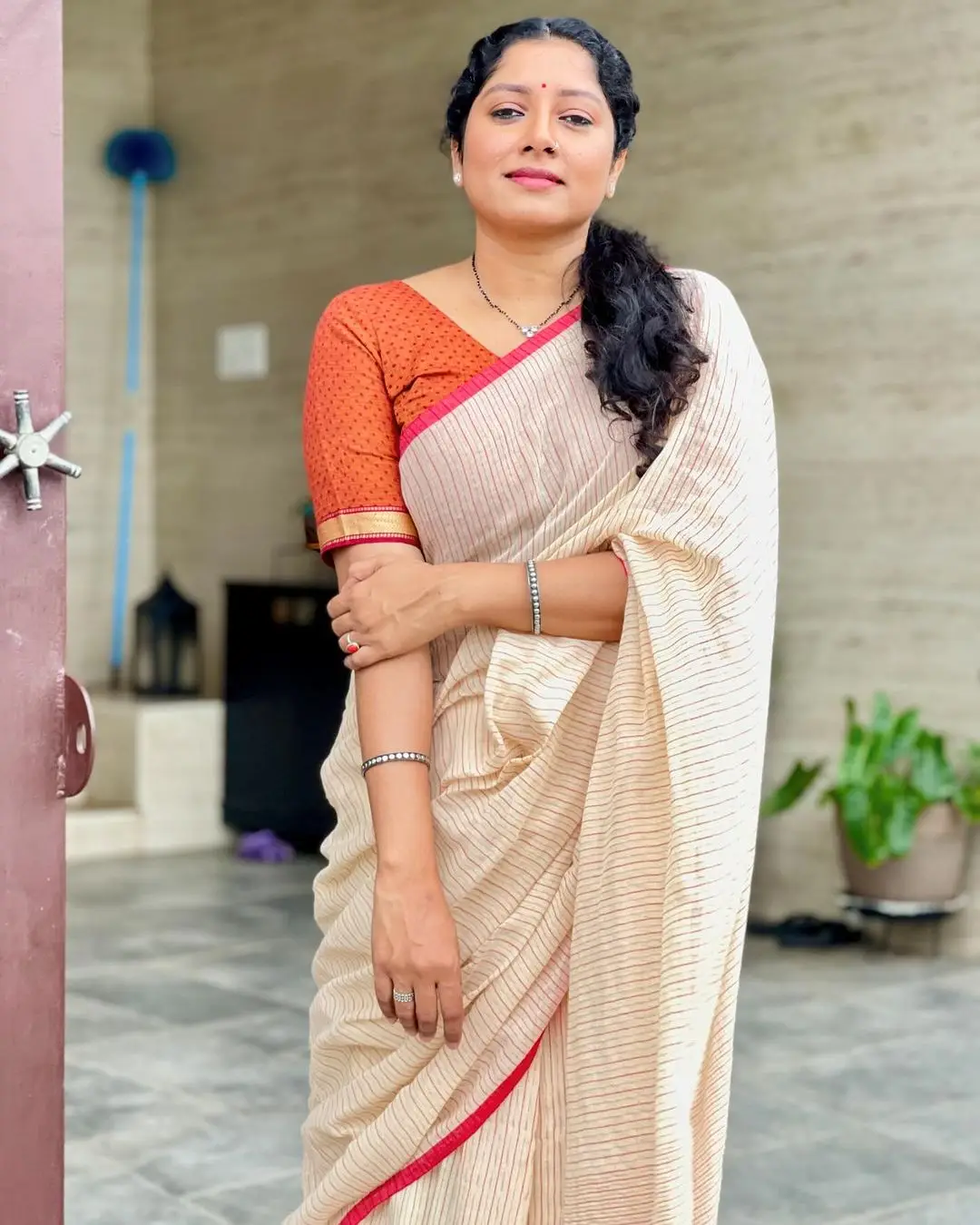 Malayalam Actress Anumol Images in White Saree Orange Blouse